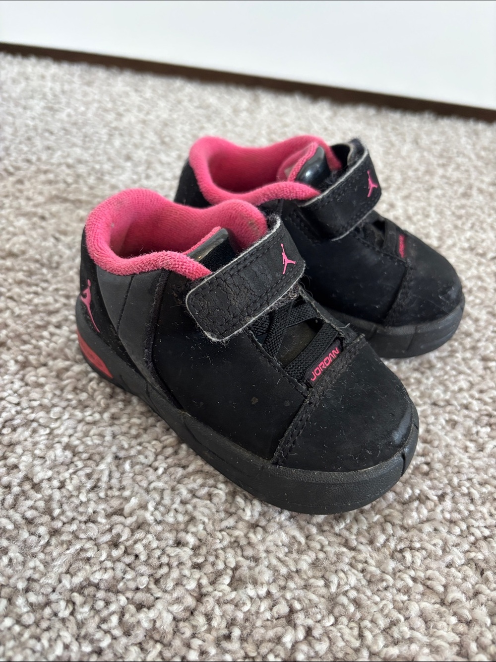 Nike Kids Nike Air Jordans Black and Pink Velcro Low-Top Sneakers